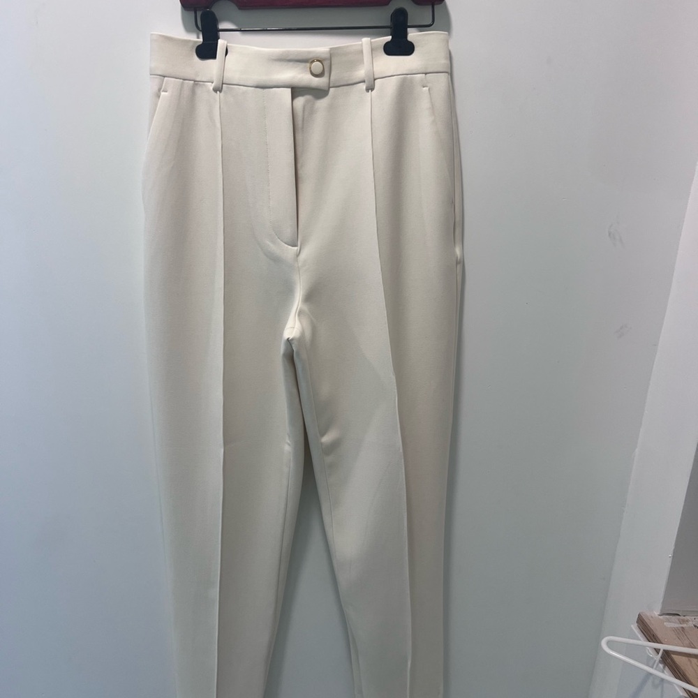 St. John Ecru Tailored High-Waist Trousers Retails for $795.